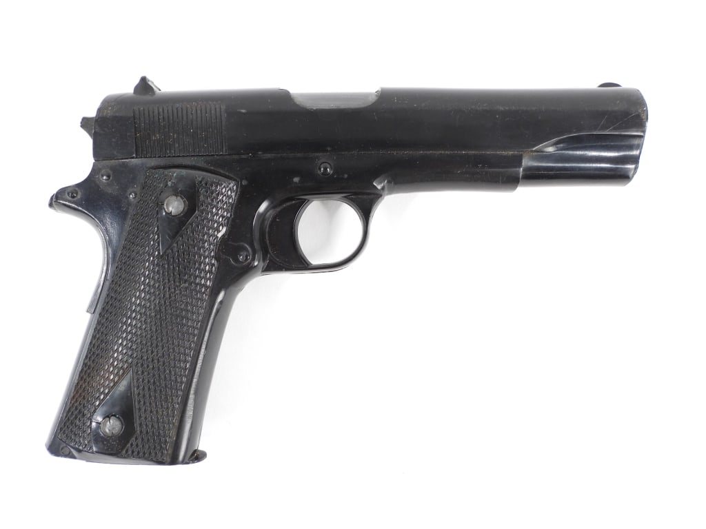 U.S. Navy Colt Model 1911 Dummy Training Pistol: United States Black-coated Colt Model 1911 dummy gun filled with lead for weight, marked on the left side of the slide "CAPT. F.D. PEPPER". Overall lg. 8 1/4".