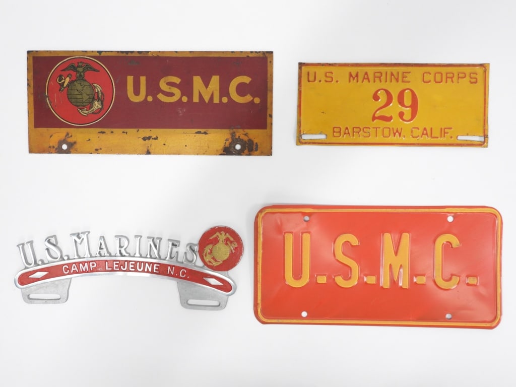 U.S. Marine Corps License Plates and Bracket: United States An aluminum license plate bracket marked "U.S. MARINES" with an eagle, globe, and anchor, and marked "CAMP LEJUNE N.C." with red-painted infill; a red-painted license plate marked "U.S.M