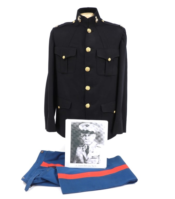 USMC Uniform of Col. Charles B. Taylor: United States C. 1907 Early 20th-century dark blue dress tunic with eagle, globe, and anchor insignia on the collar, pin back Colonel's insignia on each epaulet, brass U.S. Marines buttons, a tag on t