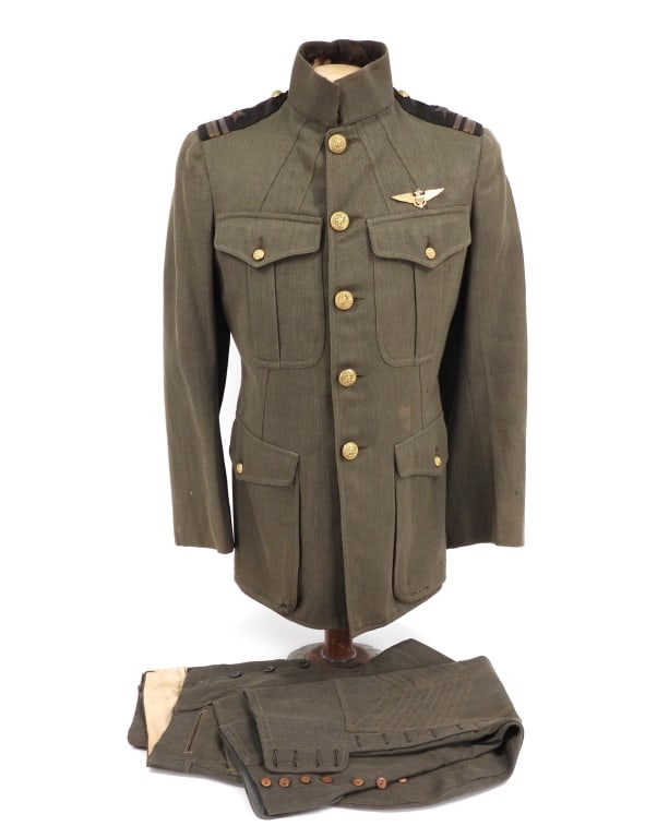 WWI Naval Aviator Charles G. Jackson's Uniform: United States C. 1918 Green twilled tunic with brass navy buttons, officer's epaulets, aviators wings above the left breast pocket, Boston tailors label, and a pair of green twilled breeches. Note: Ch