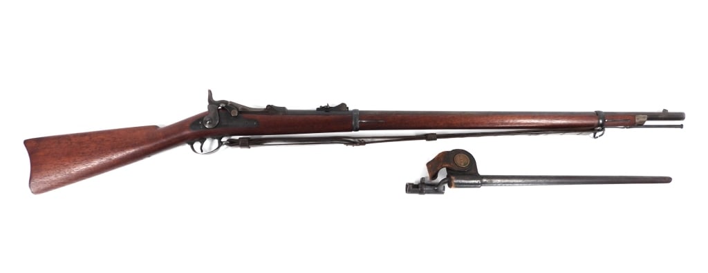 U.S. Model 1879 Trapdoor Springfield Rifle: United States C. 1884 .45-70 caliber, serial number 255467, walnut stock with a crisp cartouche on the left side, blued finish, color case hardening on the barrel tang and inside the breech block, loc