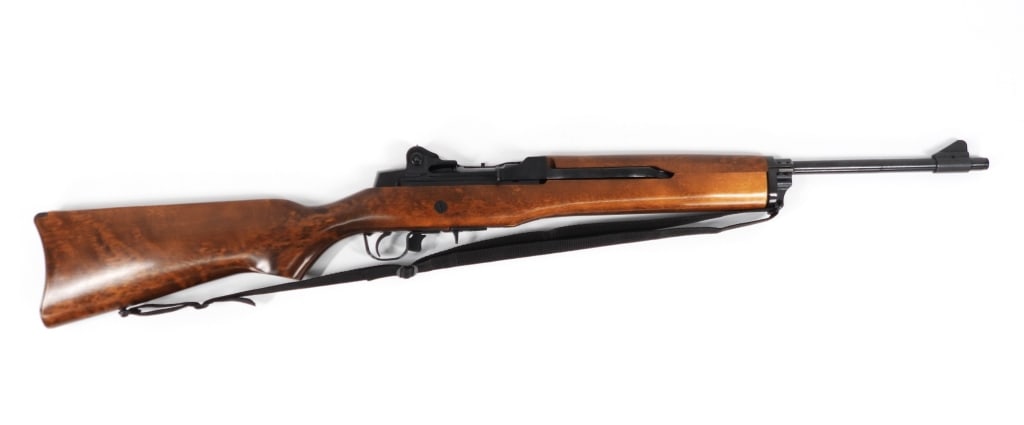 Ruger Mini-14 Rifle: United States .223 caliber, serial number 182-87055, walnut stock and hand guard, blued finish, marked on the receiver tang "RUGER/MINI-14/CAL. .223", marked on the left side of the receiver with addr