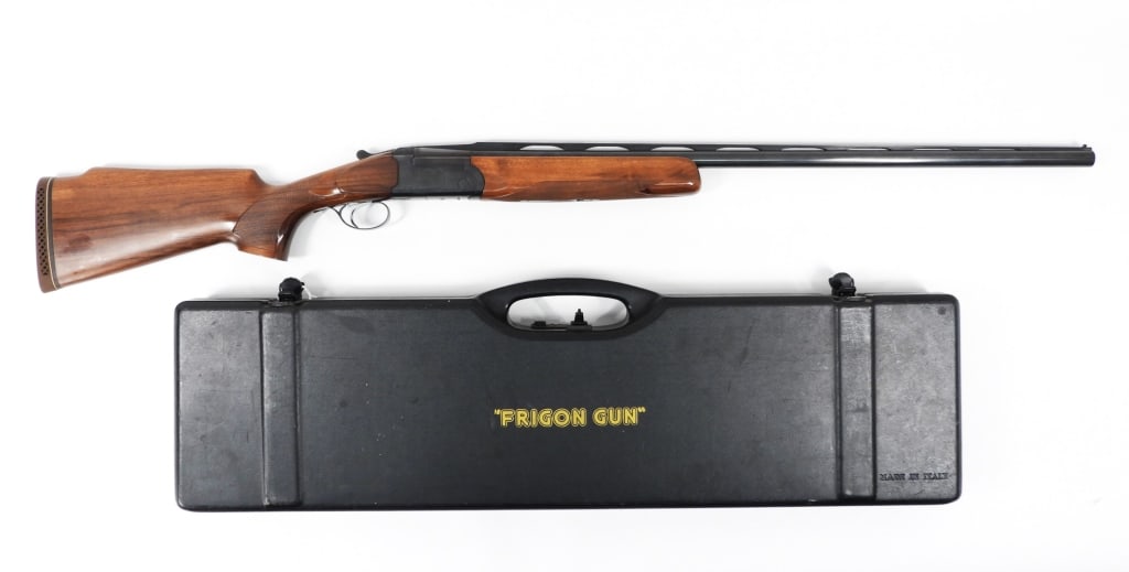 Frigon Trap FT1 Single Barrel Shotgun: Italy 12 gauge, serial number 135145, walnut stock with a checkered wrist and forend, blued finish, marked "FT1" on both sides of the receiver, marked "FRIGON/TRAP" under the receiver, marked on the l