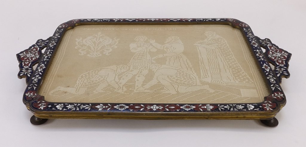 French Bronze & Enamel Plateau Tray: FRANCE, 19TH CENTURY A French bronze and enamel plateau tray. The tray is heavily decorated with blue and red enamel surrounding white enamel in a floral repeating pattern. The doily is entitled "The 