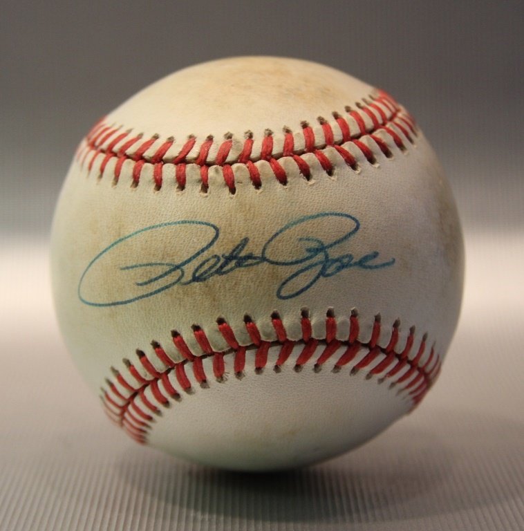 Pete Rose Signed Baseball: Pete Rose Signed Baseball. Rawlings ball signed in blue ball point pen on sweet spot, some staining on ball.Provenance: This is a single owner collection, from Hall’s Nostalgia in Arlington, MA. All