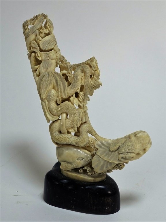 Chinese Carved Antler Snake Bird Fish Sculpture: Chinese Carved Antler Snake Bird Fish Sculpture"CHINA, 20TH CENTURY A Chinese carved antler depicting a reticulated forest scene. The sculpture includes intricately detailed fish, birds, snakes, and a