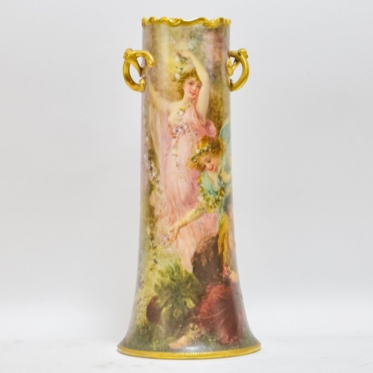 French Limoges Porcelain Romantic Nude Female Vase: FRANCE, LATE 19TH CENTURY A fine French Limoges Romantic porcelain vase. The vase depicts three beautiful women in flowing attire adorned with garlands of flowers. The full standing female in pink gow