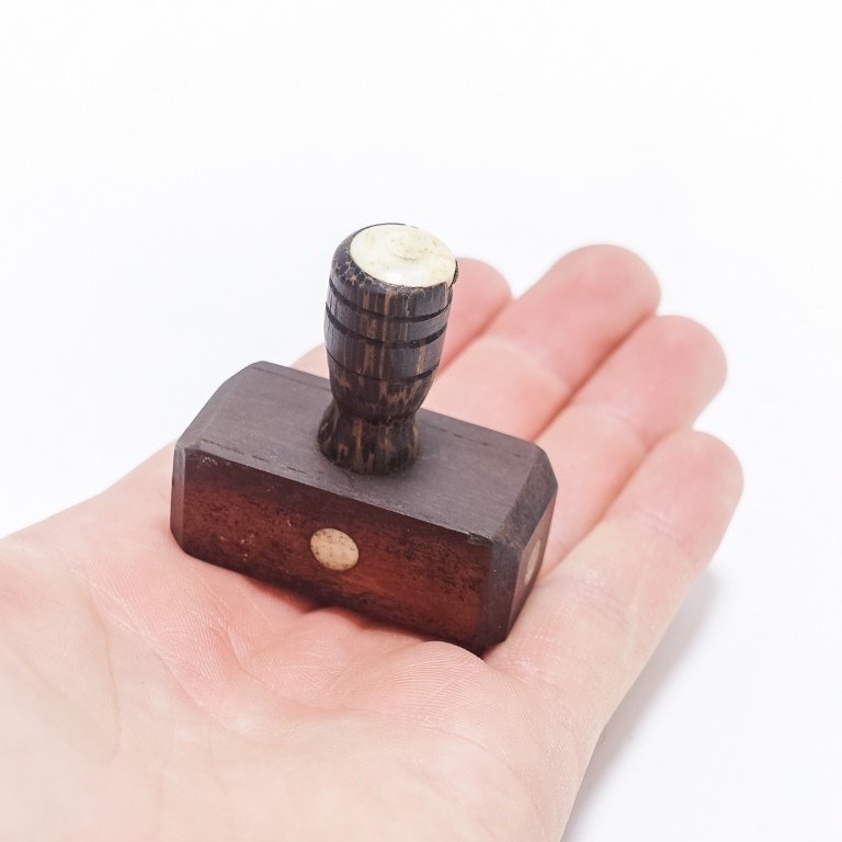 Rare 19C. Scrimshaw Wood & Bone Whaling Log Stamp: UNITED STATES, 19TH CENTURY A very rare scrimshaw wood and bone whaling log book stamp of a coffin. This was used to denote the death at sea of a crew member. It is of simple block form carved casket 