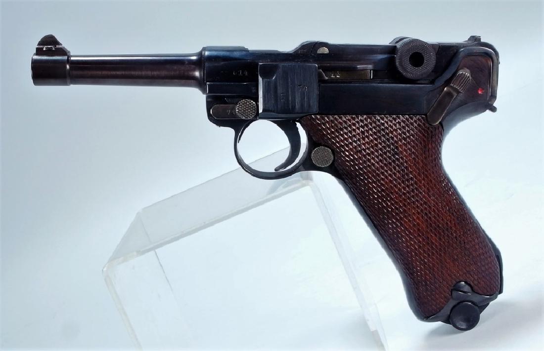 WWI Period Erfurt .30 cal German Luger Pistol: GERMAN, WORLD WAR I PERIODA World War I period Erfurt .30 caliber German Luger. The Luger consists of a checkered wood handle and steel barrel. The makers proof of a crown is engraved on the top of th