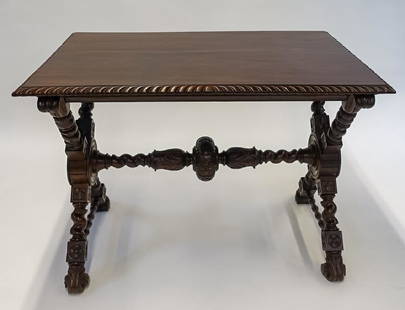 Luigi Frullini Italian Renaissance Walnut Table: ITALY, 19TH CENTURYAn Italian Renaissance style carved walnut library table attributed to famed wood worker Luigi Frullini. The table is supported by an X frame with carved Florentine style florals in