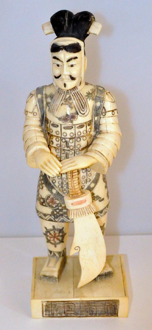 Chinese warrior carved bone statue: Chinese Warrior carved bone figure of gentleman - carved from water buffalo bone. Polychromed profusely - warrior with ceremonial weapon custom base approx. 2 1/2 x 3 1/4 inches - height approx. 10 in
