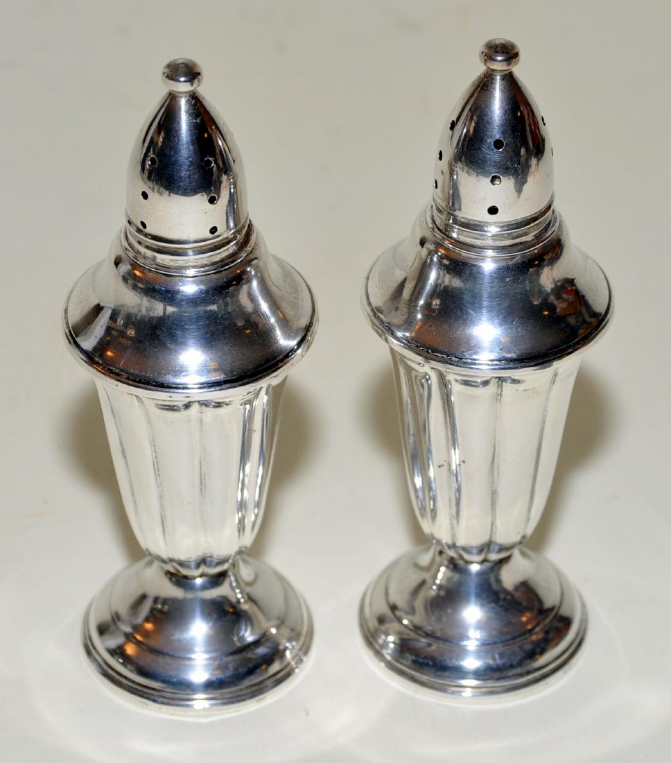 Sterling salt and pepper vintage: Glass lined pair sterling salt and pepper shakers vintage in nice condition-about 5 inches high marked sterling on bottom
