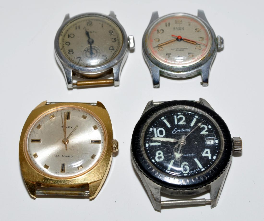 Vintage watch collection -four: 4 vintage watches with no bands present- Swiss Rima- , self wind Timex, black face Endura, and Emco with red sweep hand - radium hands for the hour - all appear to be working but no guarantees
