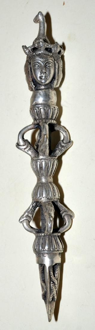 Demon stake bird claw Tibetan: Silver tone demon stake with bird claws and demon heads - tibetan tent peg to keep evil spirits out -bronze with silver plating - about 8 1/4 x 1 inch