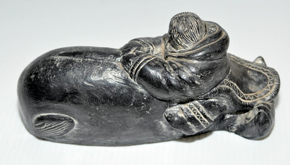 Eskimo stone carving native: Eskimo stone carving of man riding whale - old native North American Indian Canadian or Alaskan. Nice natural patina. Great example of Eskimo folk art. About 2 1/2x 3 1/2 x 7 1/2 inches.