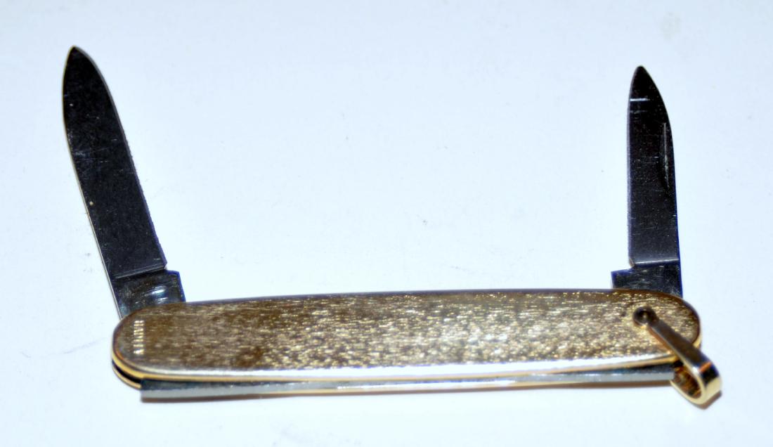 Watch fob pocket knife: Pocket knife watch fob style 1st quarter 20th c. -handle marked Hadley - new old stock probably never sold or used - Marked Imperial stainless on blade --about 3 inches gold color