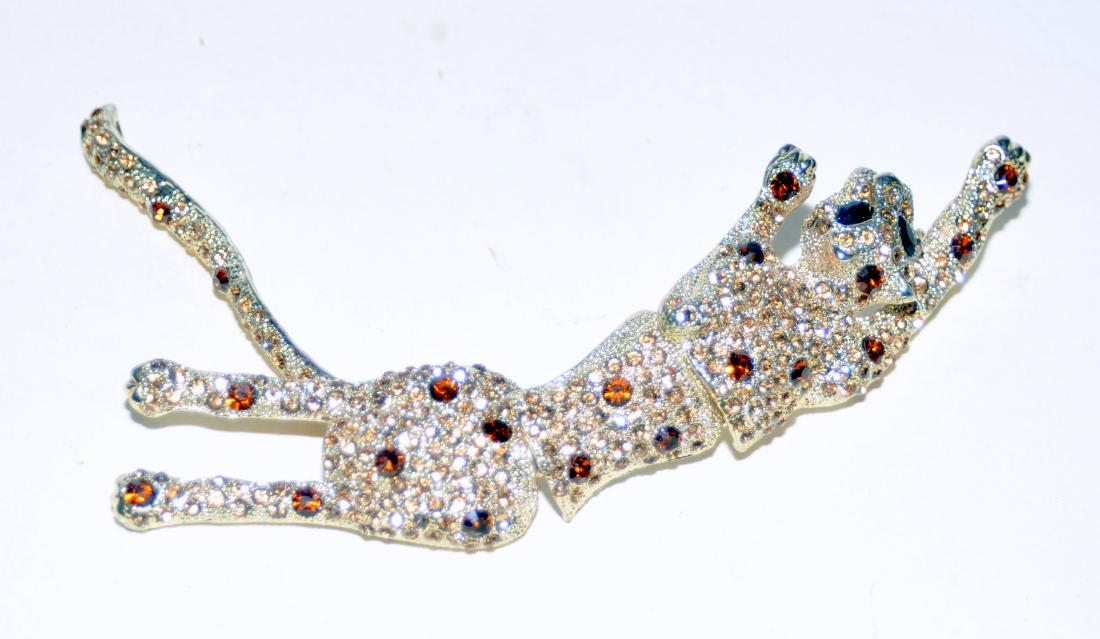 Panther reticulated pin rhinestones: Vintage panther large pin encrusted with stones in different colors giving the panther a realistic colored body. It has 4 hinged sections so it moves with you - about 7 inches long and in nice conditi