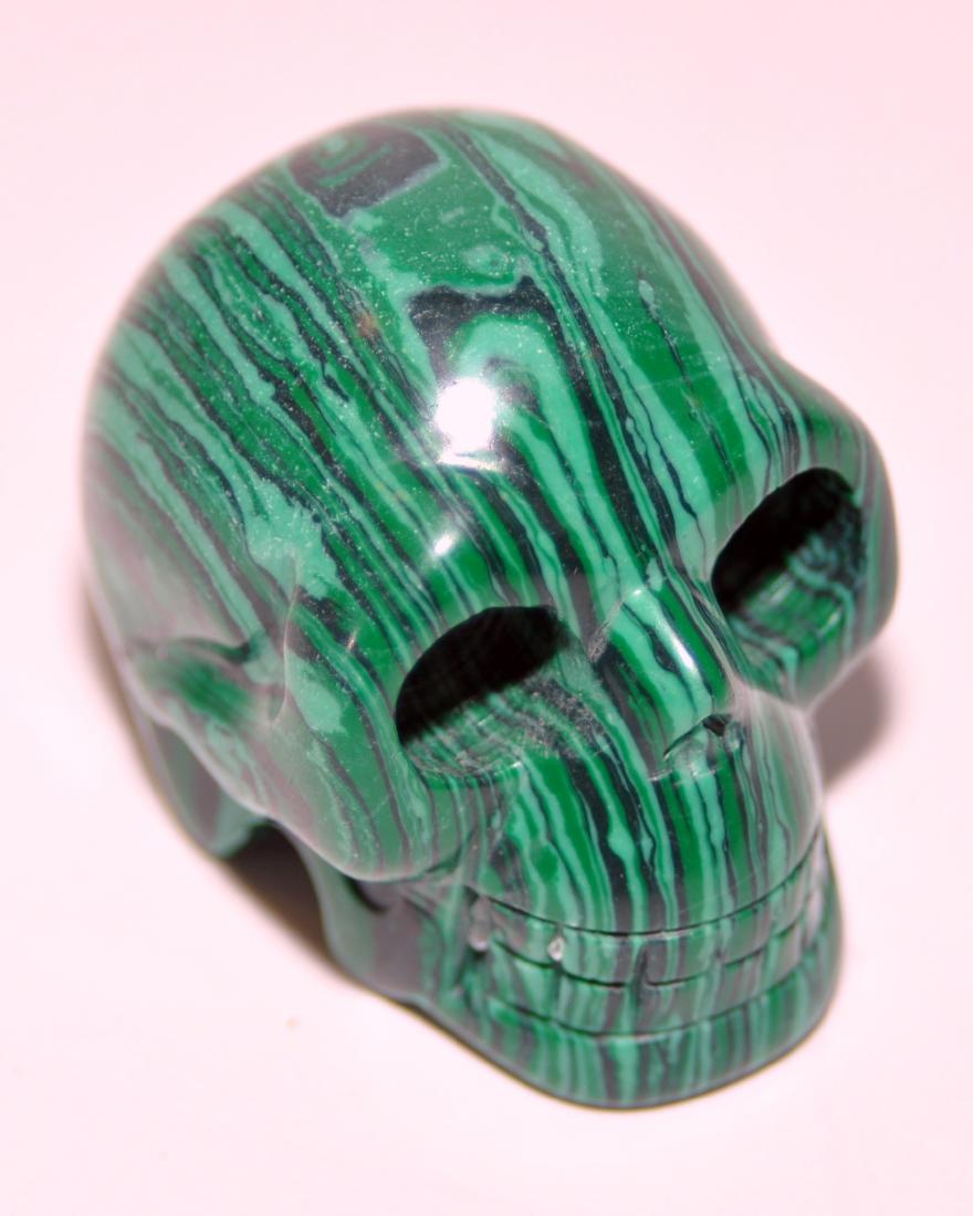 Skull malachite carved stone: Skull carved from malachite well carved with deep relief - fine polished surface and color is vivid and bright -about 1 1/2 x 1 3/4 x 1 1/3