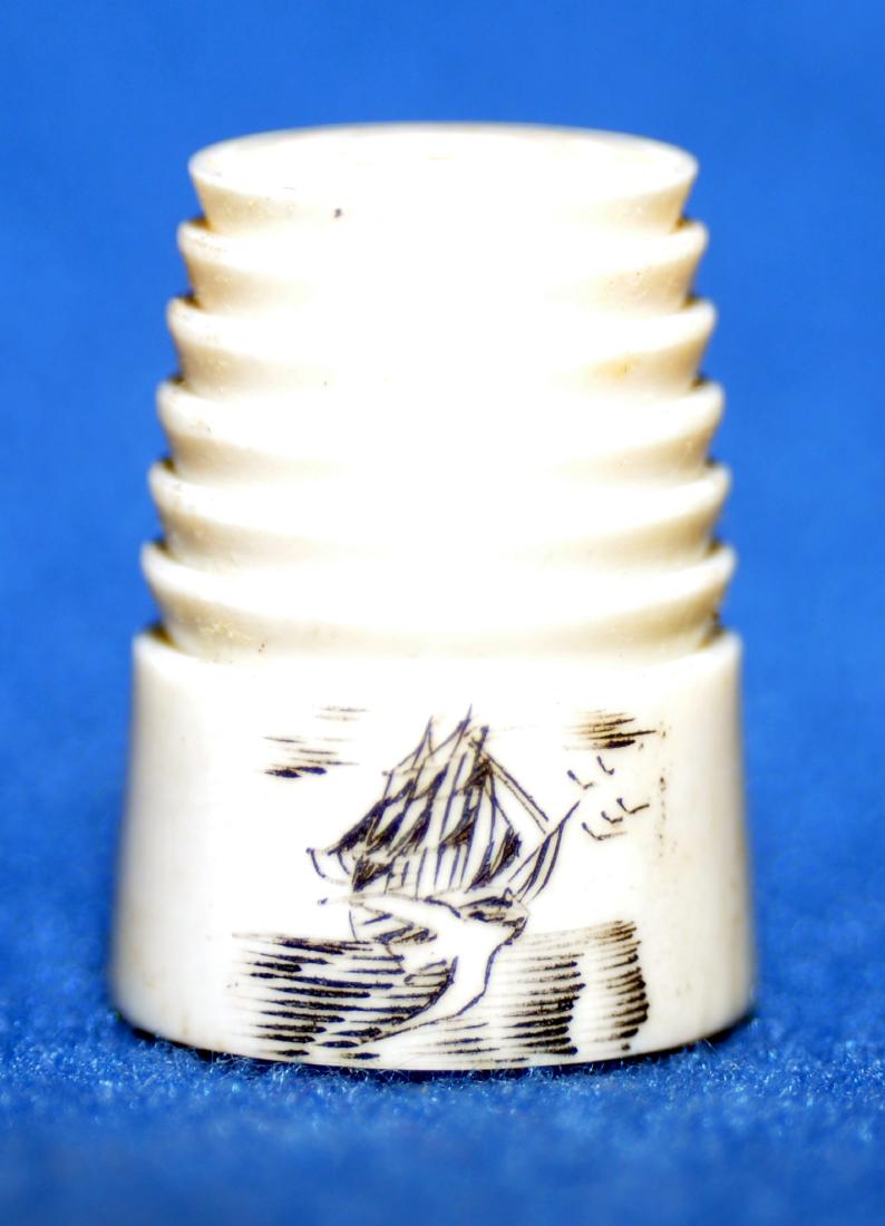 Scrimshaw thimble sailing ship: Scrimshaw thimble with sailing ship carved on pan bone - ridges on sides - just under an inch in size