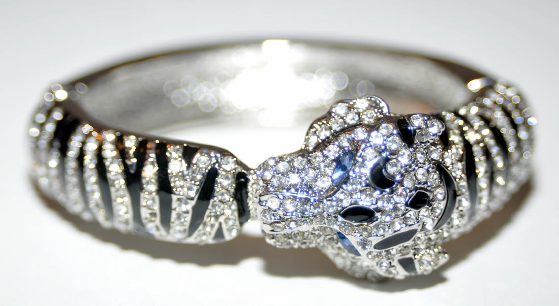 Panther rhinestone bracelet vintage: Vintage panther rhinestone bangle braclet with blue stone eyes -about 2 3/8 inches internal measurement- a great looking bracelet