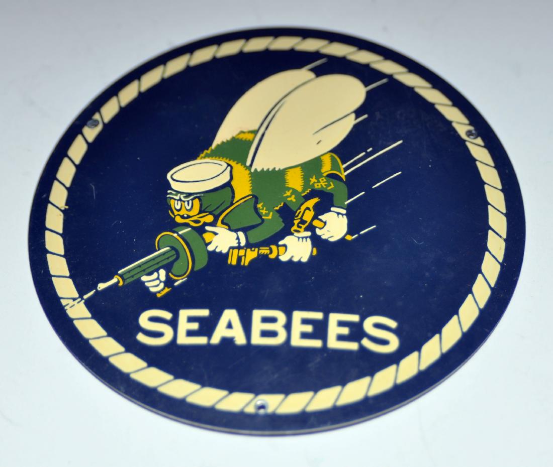 Seabees enamelled WWII plaque: Enamelled plaque original from World War II era -about 3 1/2 inches diameter showing bee with Thompson machine gun - excellent condition