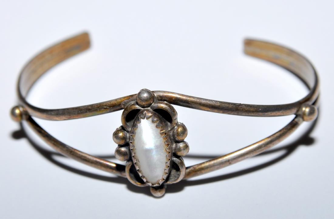 Sterling cuff bracelet vintage gemstone: Mother of pearl central stone - sterling cuff bracelet vintage in custom sterling silver American Indian design - bezel set. Cabochon stone is marquis shape.