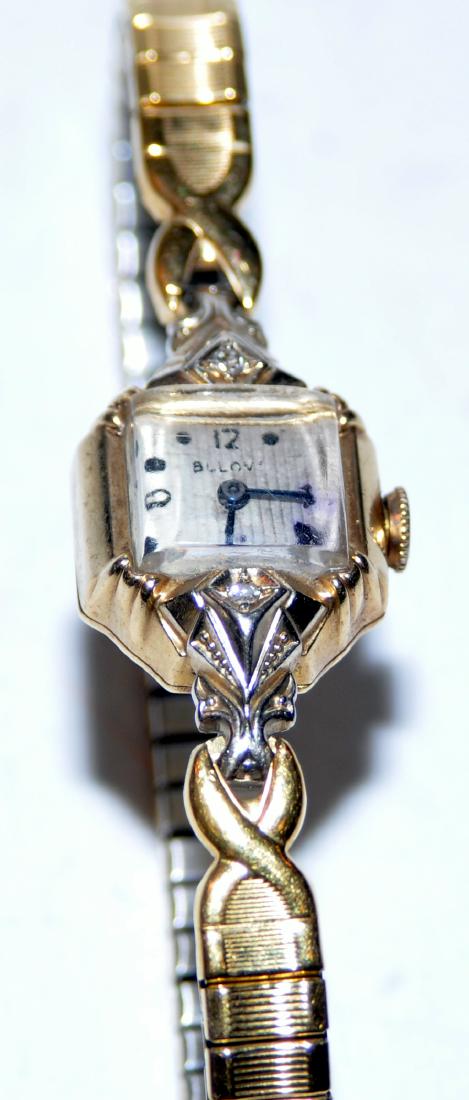 Bulova wristwatch vintage gold: Bulova gold wristwatch marked 14k with original band - Square face - nice clean crystal, 2 diamonds on either side of warch . Face has minor losses - not bad for age . - all original - 1 1/2 inch head