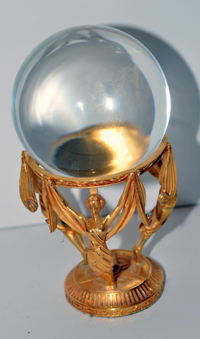 Crystal ball on stand/ ladies: Large crystal ball about 3- 4 inches on gold tone metal stand with 3 ladies holding ball - marked Crystal Visions, crafted in Malaysia- about 8-9 inches .