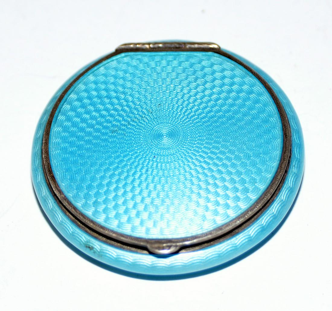 Sterling French enamel compact antique: Sterling French enamel - late 19th c - enamel appears to be intact - compact has mirror and powder- about 2 inches diameter