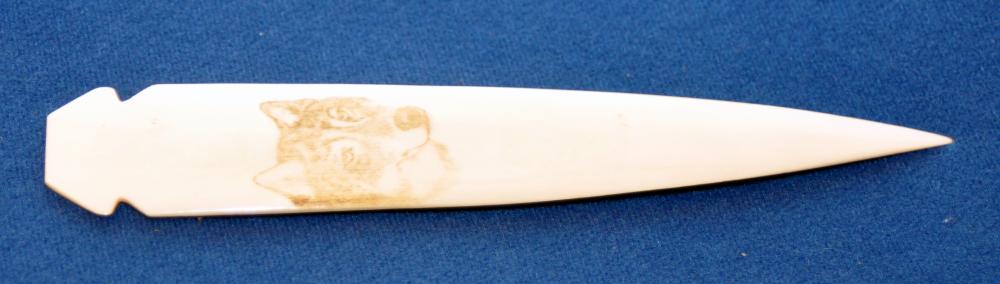 Bone letter opener -wolf engraved: Bone(cow) letter opener with husky- wolf engraved on the polished bone surface- about 7 1/4 inches long.