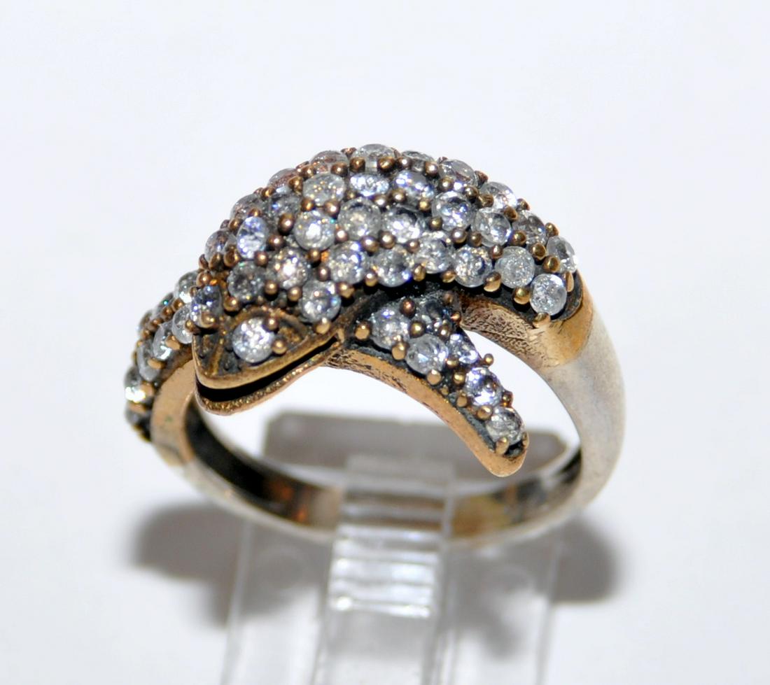 Dolphin ring encrusted stones: Sterling dolphin ring encrusted with clear stones- possibly white sapphires= about size 7