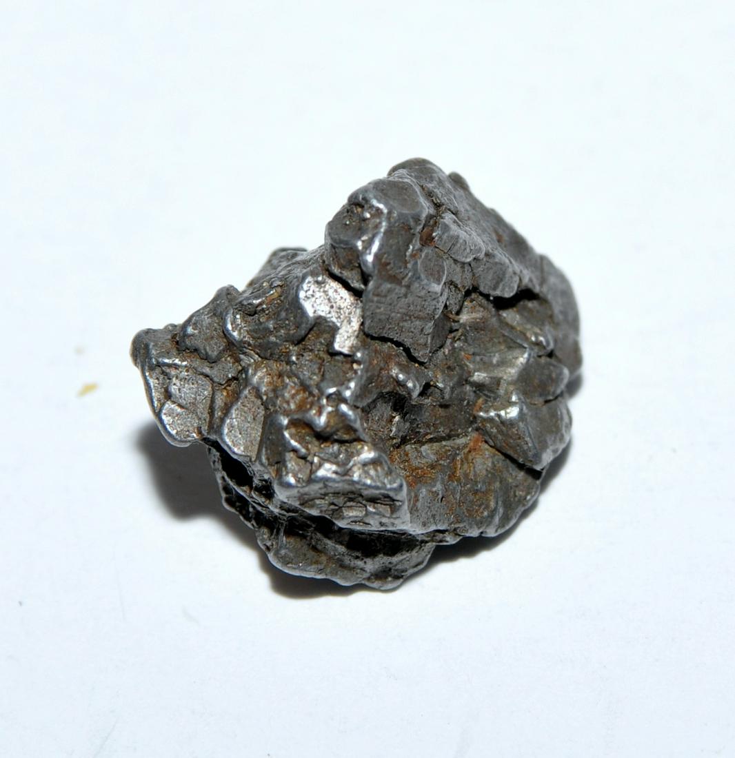 Meteorite specimen Sikhot Alin -: Meteorite specimen from Sikhot Alin - about 9.1 g and 15x 17 mm