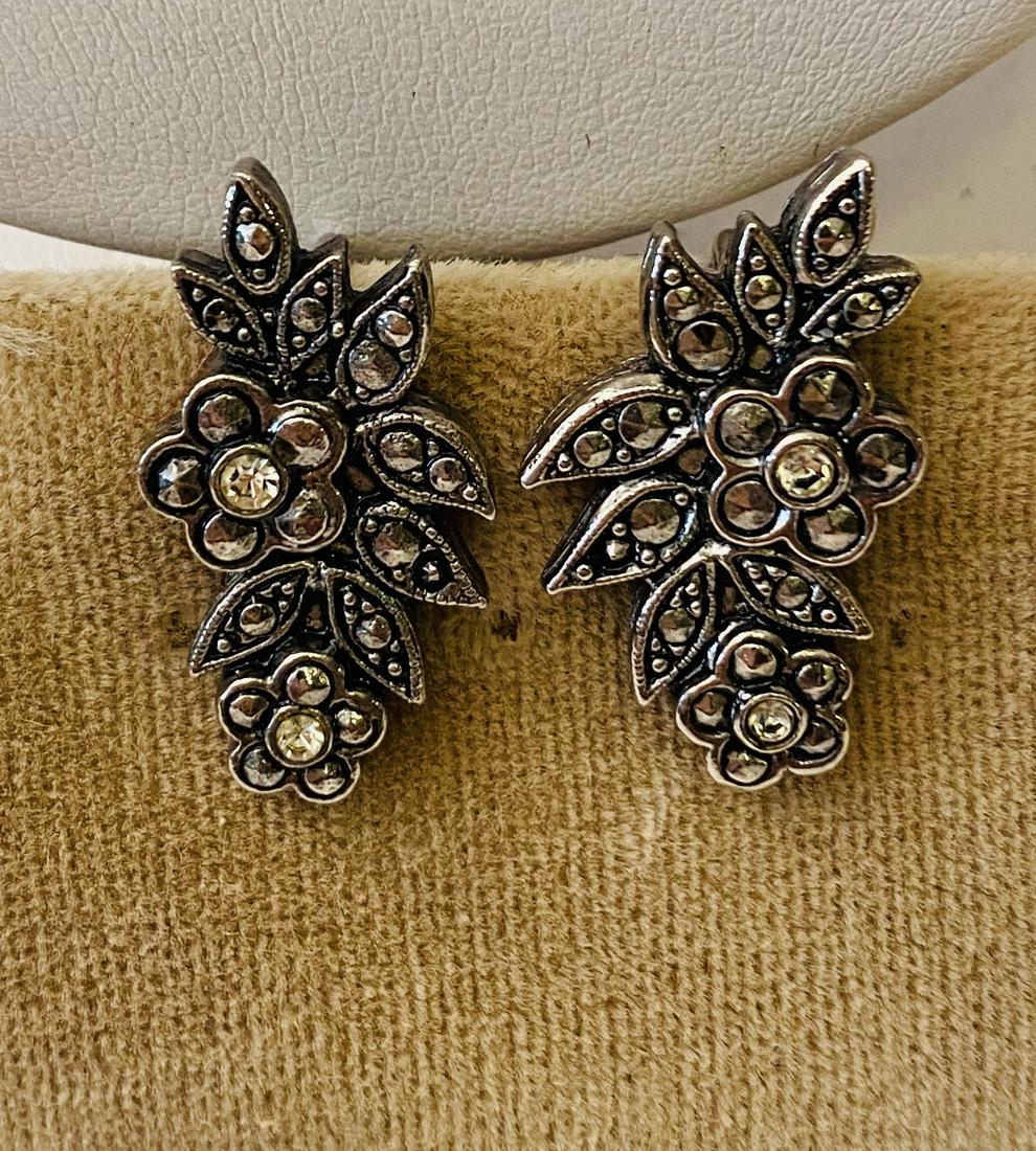 Marcasite sterling earrings vintage: Sterling marcasite vintage earrings with clip back . Flower design about 1 inch high.