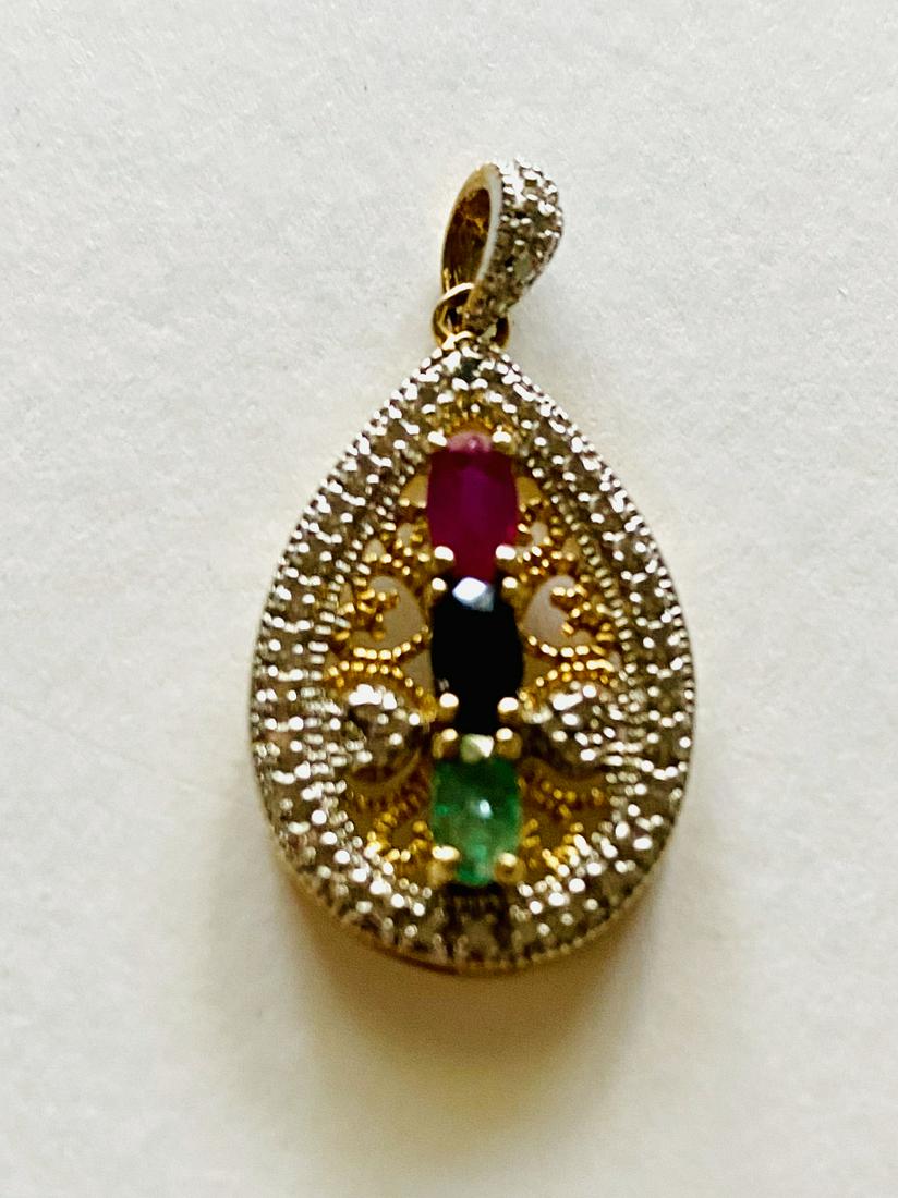 Vermeil ruby, emerald sapphire pendant: Sterling with gold overlay pendant with 3 prong set stones- natural ruby, emerald and sapphire gemstones set in piercework setting - about 1 1/4 inch high