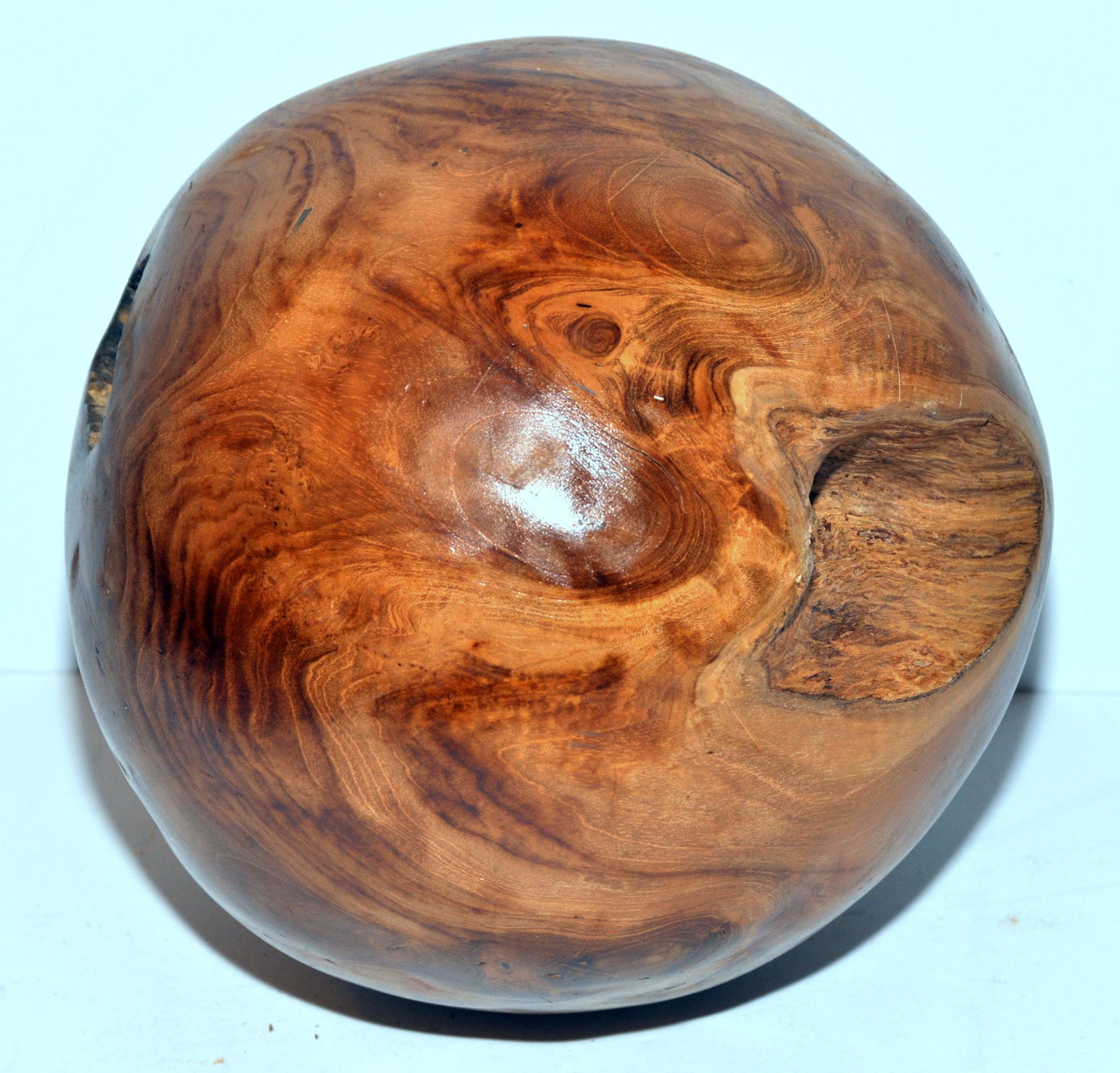 Wood sphere - 8 inches diameter: Unusual wooden sphere Indonesian hand carved burled wood with some natural crevices as shown -about 8 inches across