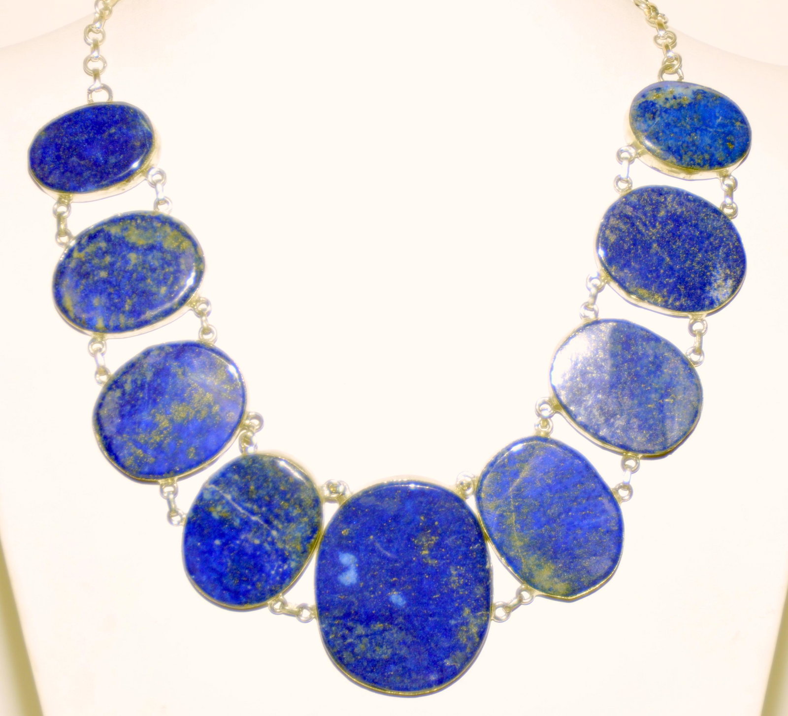 Lapis sterling princess necklace: Large lapis cabochons graduated in size and designed into magnificent princess style necklace. The lapis lazuli has deep blue cobalt color with gold flecks in the lapis. Each piece is well matched and
