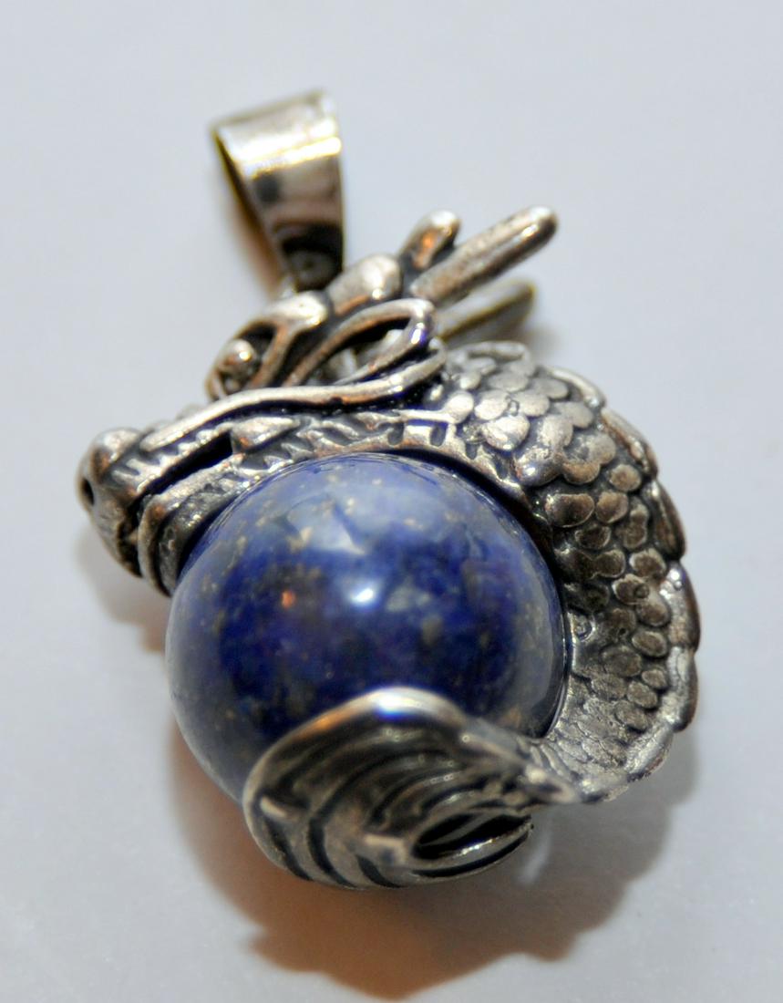 Dragon pendant with lapis sphere: Dragon lapis marcasite pendant about 1 inch diameter. Fancy dragon design with lapis sphere in bright blue gemstone . Nice condition.