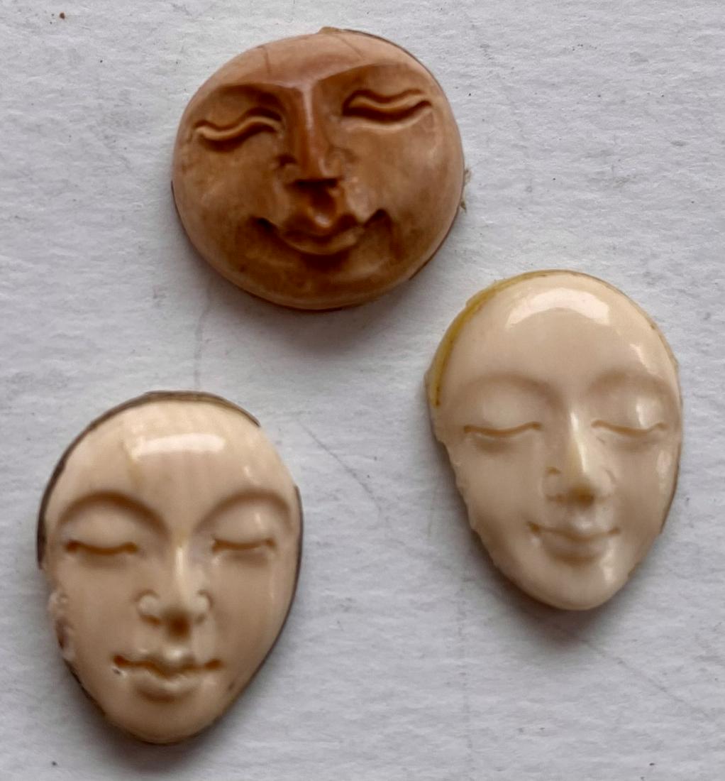 3 carved bone faces: 3 faces carved from camel bone in varying shapes and design- good detail and well designed. A little rough edge on one but if set into setting it won't be visible - about 3/4 inch .