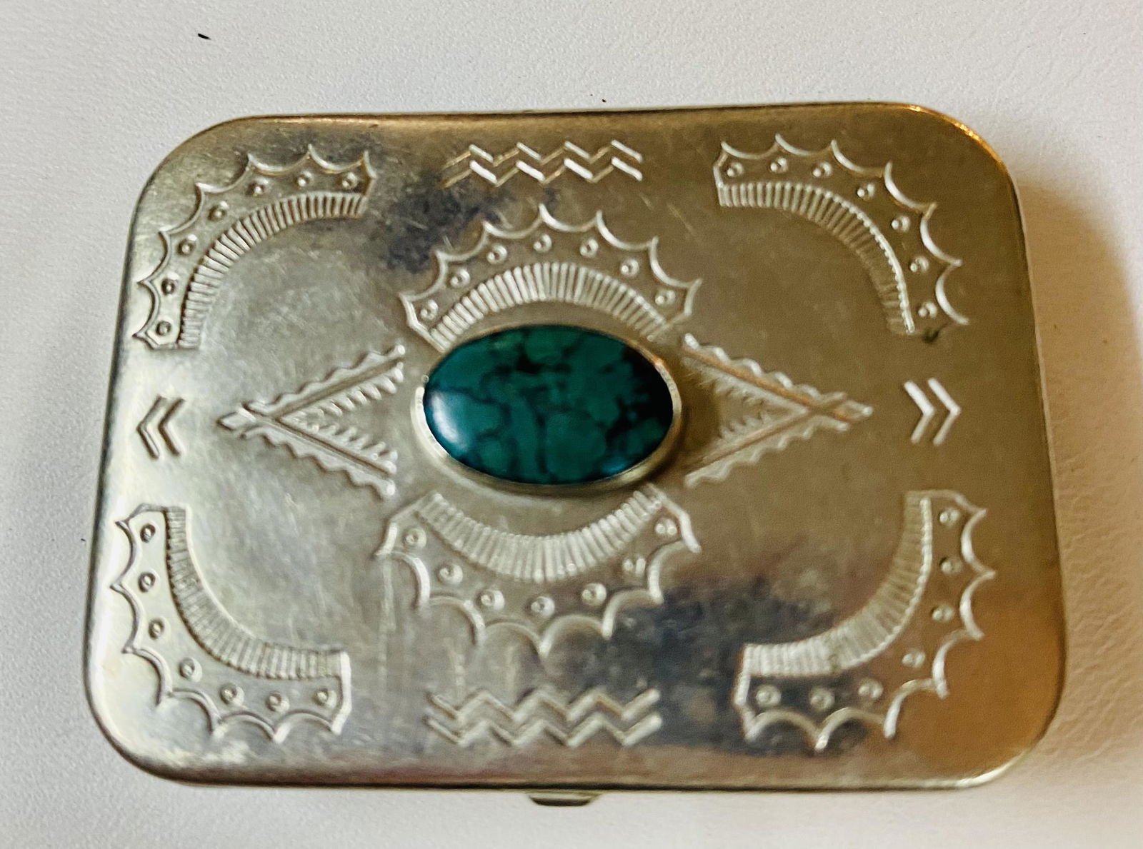 Pill case with gemstone malachite: Silver tone pillbox with malachite oval cabochon central stone - good condition - etched and about 2 x 1 3/4 inches