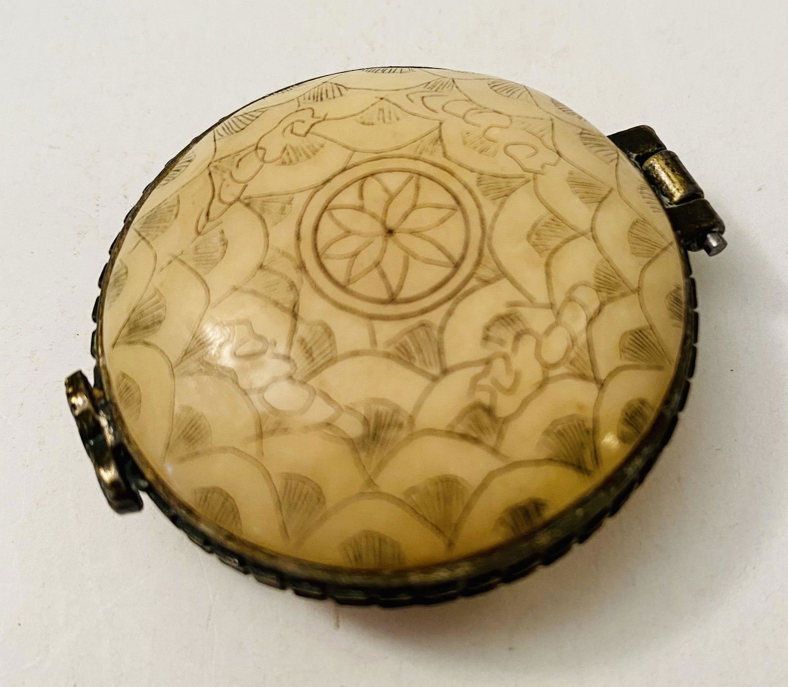 Bone round pill box polychromed: Polychromed bone (cow) round box with tight clasp - about 2 inches and condition is good.