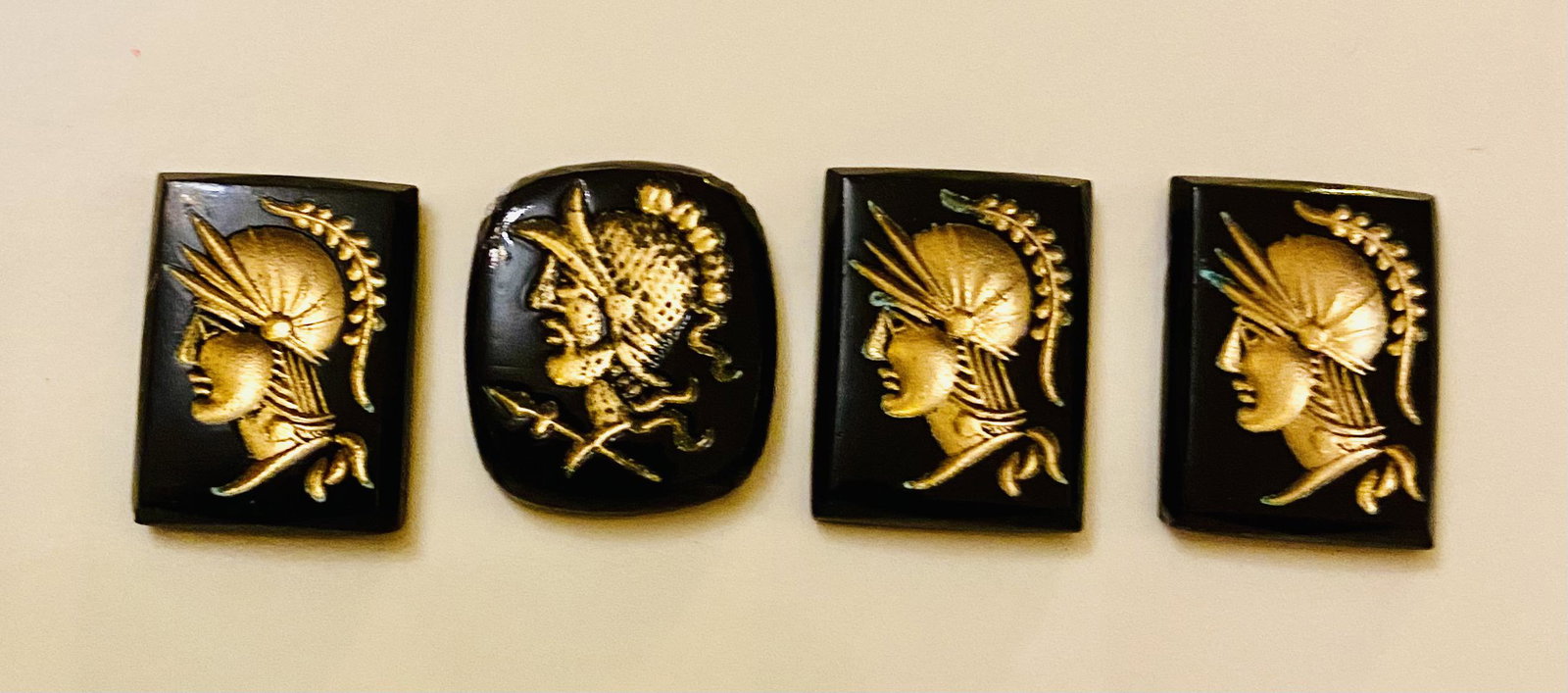 Vintage intaglio stones knights: Intaglio stones rectangular with gold knights - 3 are identical and the other has rounded corners on the rectangle . All good condition and about 1/2 5o 3/4 inch. Old material but never used.