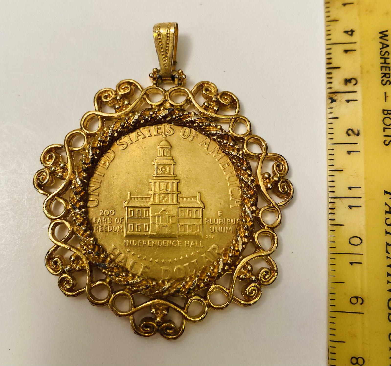 Kennedy gold plated half pendant: Kennedy gold plated bezel set pendant - about 2 inches plus