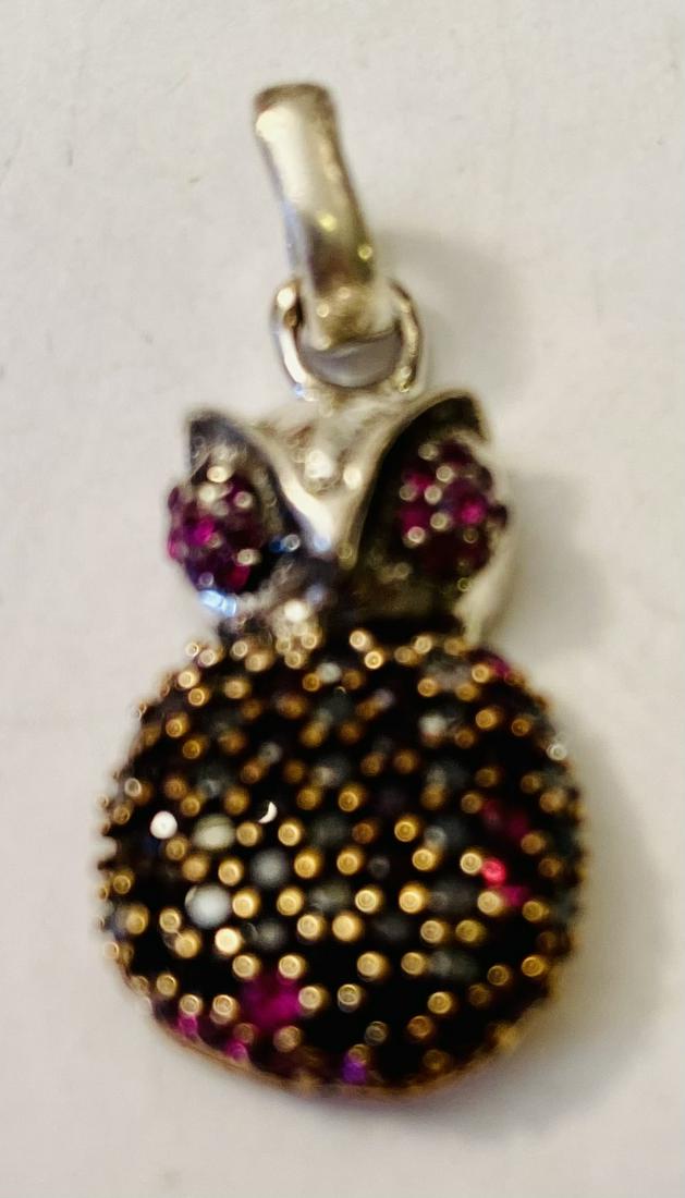 Ruby owl pendant sterling: Owl pendant vermeil sterling with matched red rubies and clear stones throughout the owl . About 2/3 inches and nice condition.