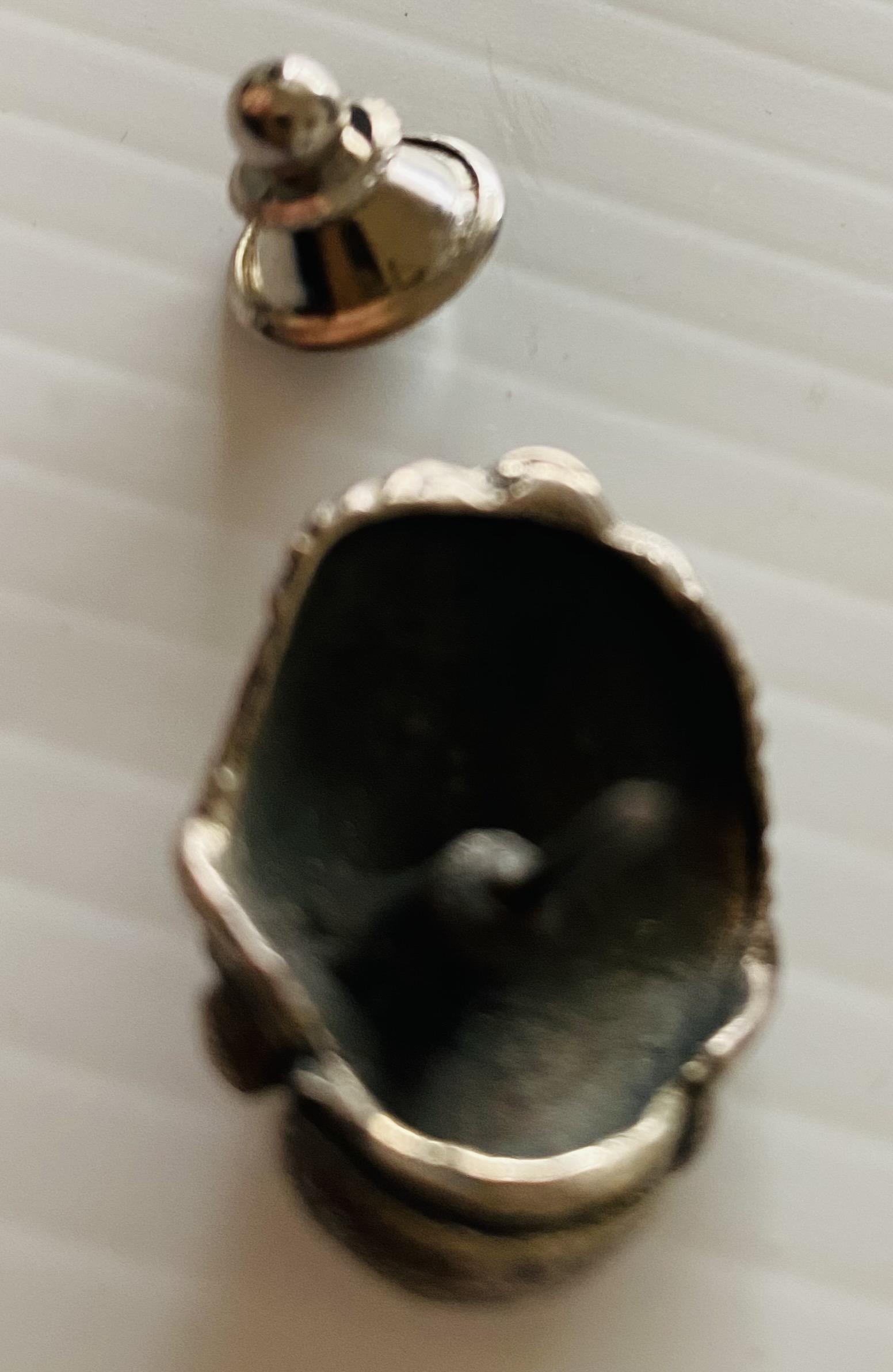 Trilobite sterling tie tac: Fossil trilobite sterling tie pin or could be used as a collar pin- really good detail on this pin - about 2/3 inches and great craftsmanship.