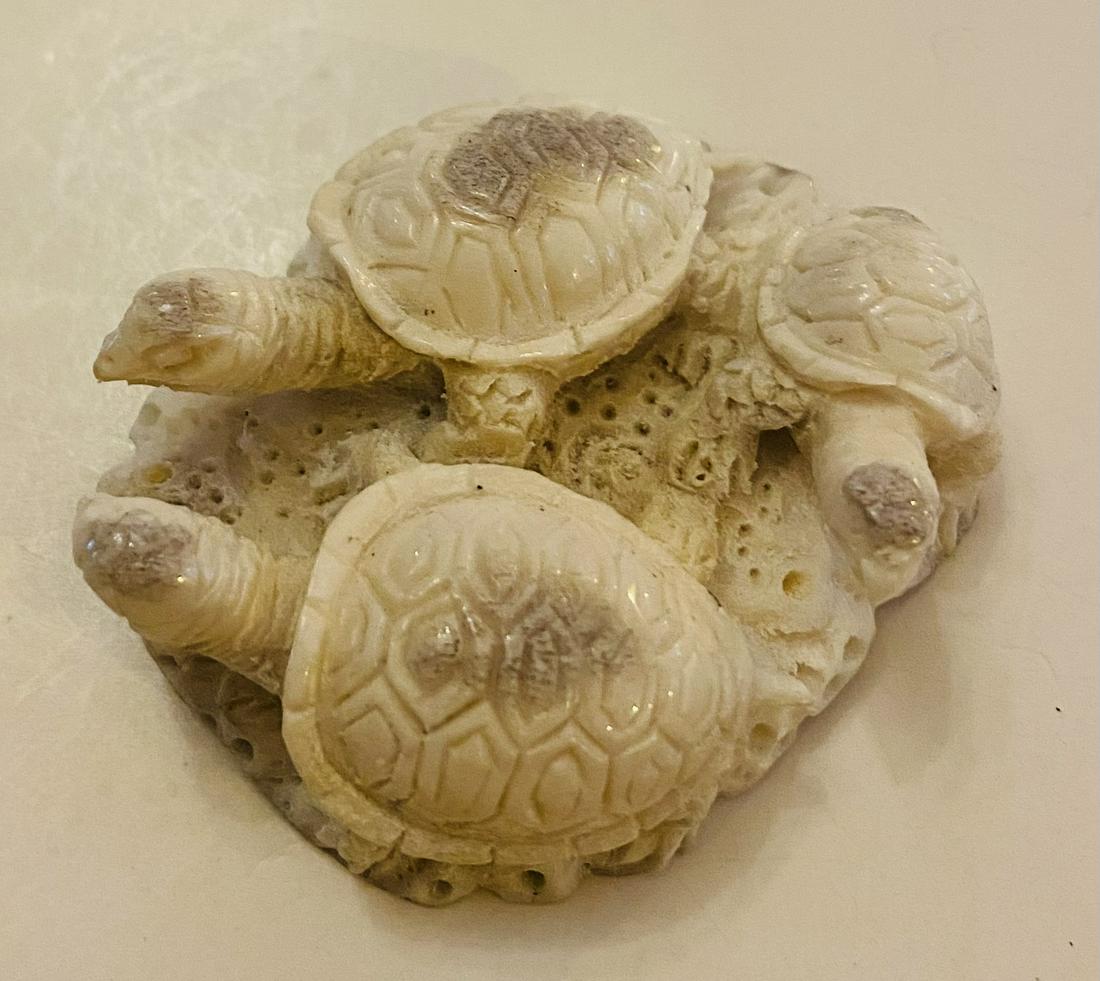 Carved statue turtle family coral: Hand carved one of a kind turtle family 3 dimensional - nice condition and detail . Approx. 2 2/3 inches across.