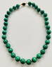 Malachite knotted beads on silk
