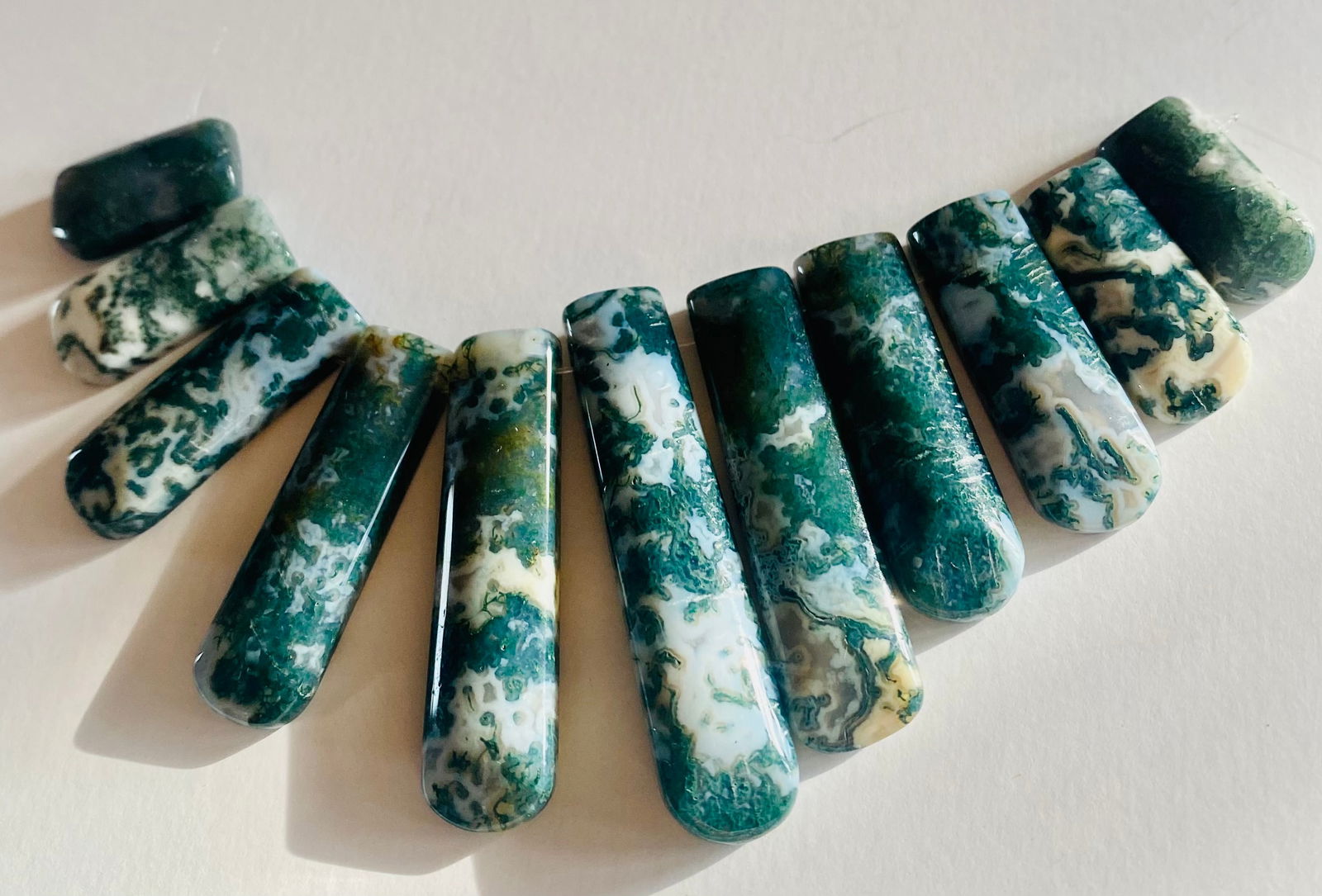 Gemstone jasper princess suite: Cabochon jasper tonque graduated stones - princess suite in nice condition -- about 11 pieces all drilled .