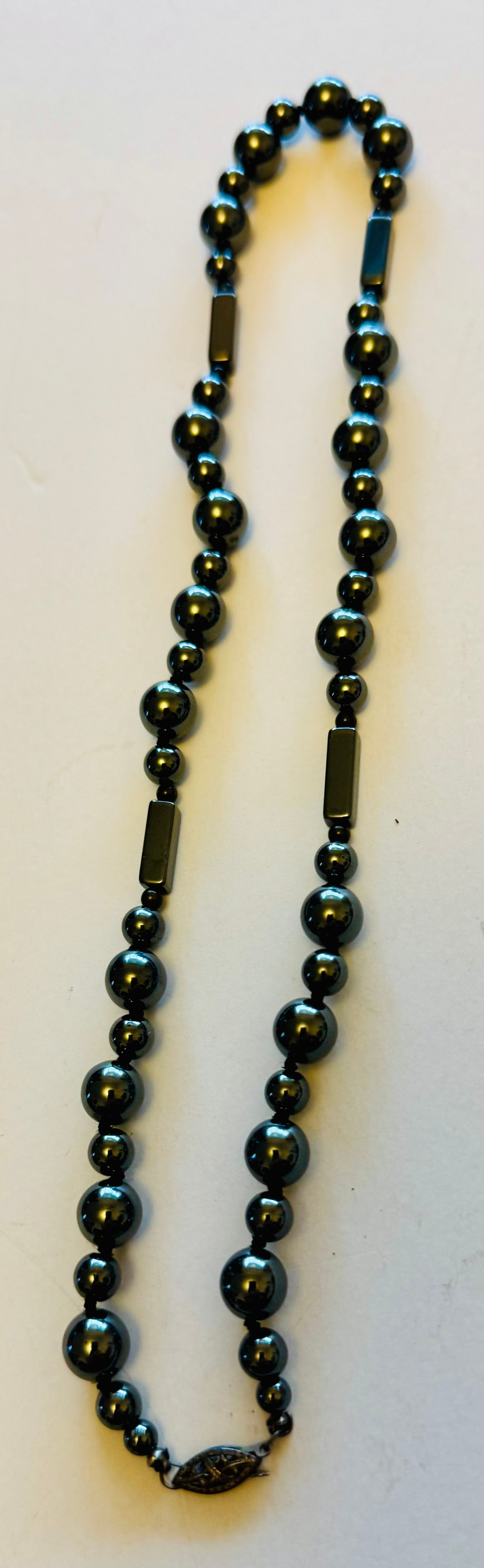 Hematite necklace varied bead shapes: Hematite necklace with good clasp and multi size beads. About 18 inches and excellent condition.