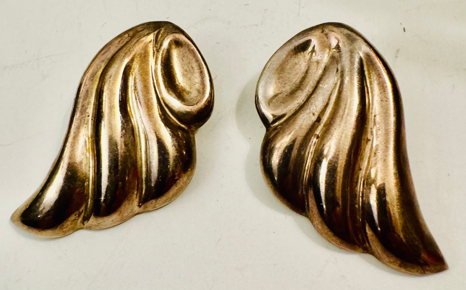 Sterling vintage earrings Mexico Taxco signed: Sterling earrings hallmarked with Taxco/Mexico and hallmark. Good condition and clip design about 1 1/2 inches