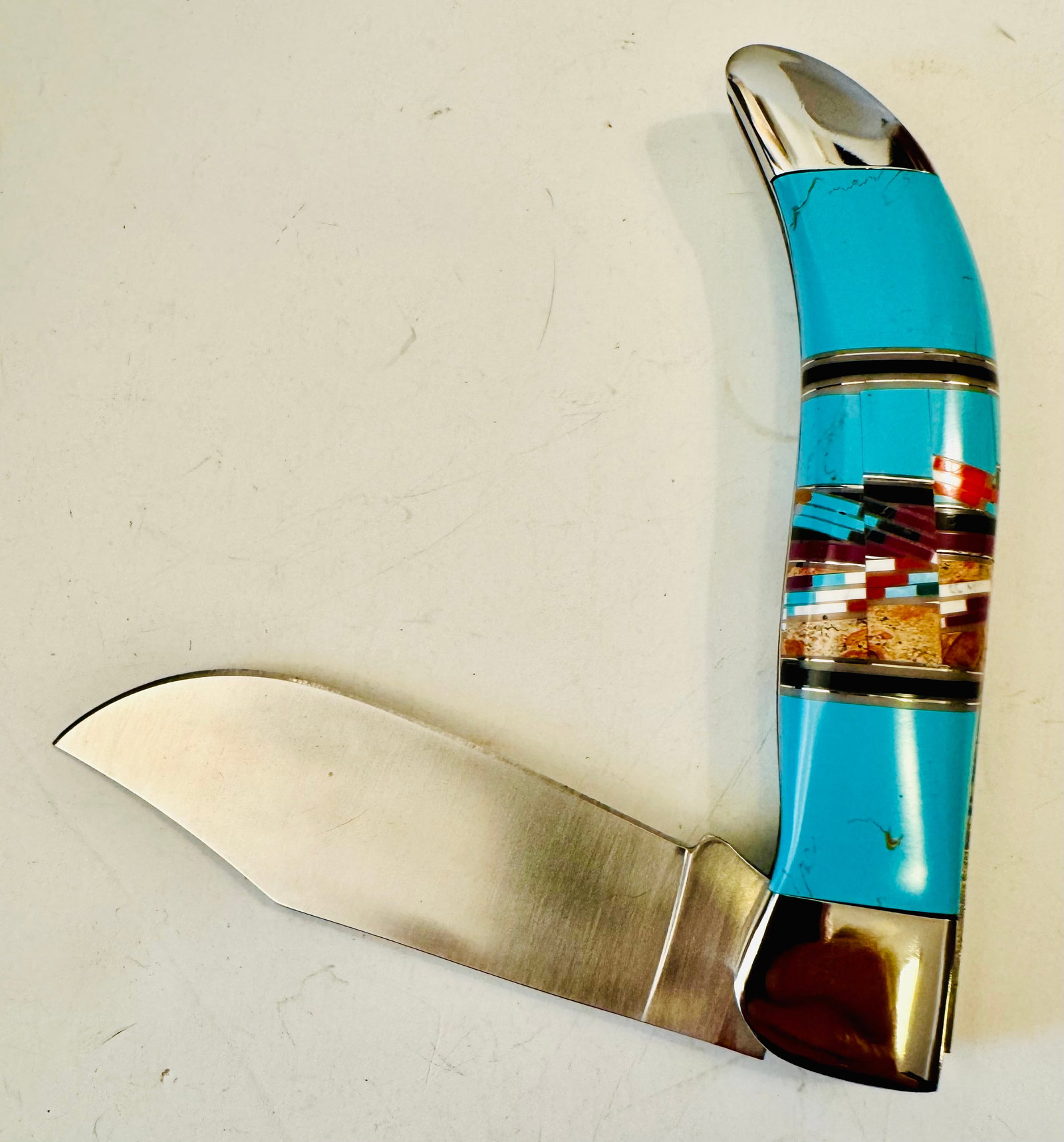 Turquoise inlaid American Indian design knife/case: Turquoise handled stainless steel knife as shown with inlaid gemstone pattern that is American Indian in design - excellent condition and about 8 inches.